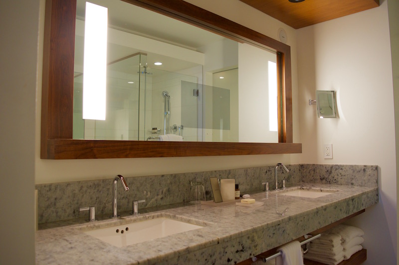 Large Counter With Dual Sinks And In-Mirror Television 