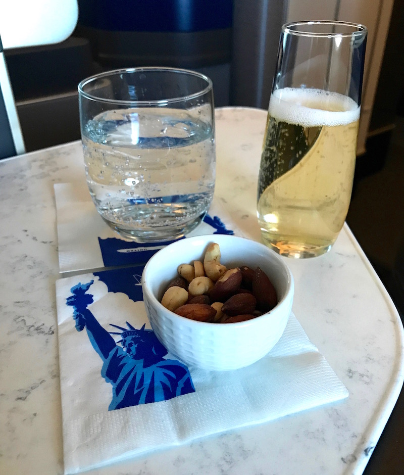 Champagne, Sparkling Water, And Warm Nuts