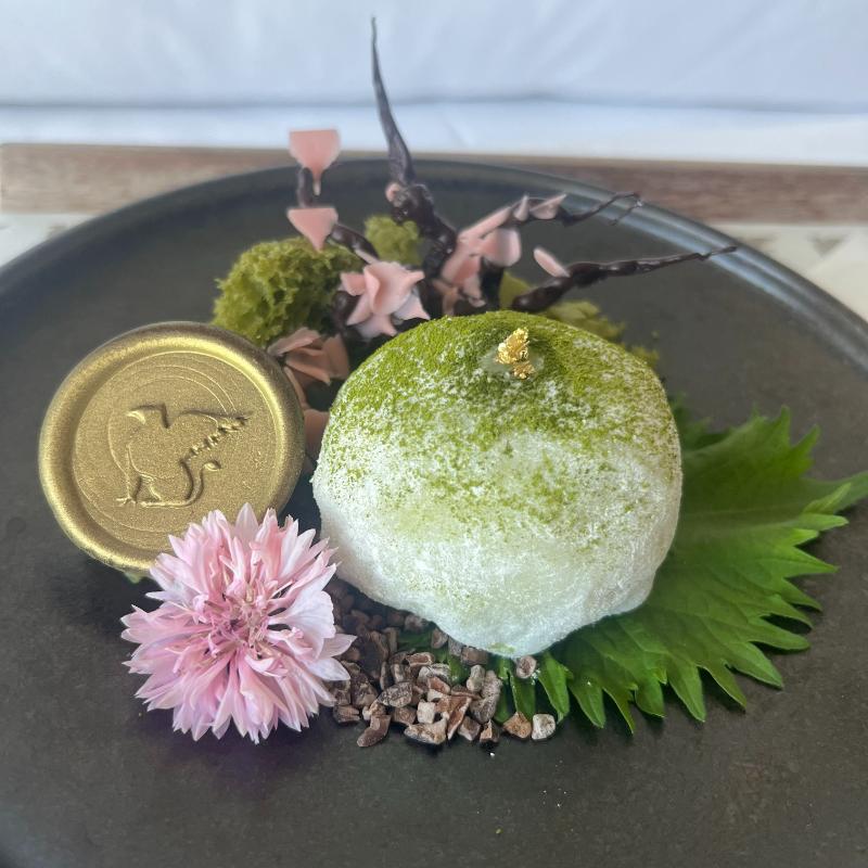 1-jw-marriott-vancouver-lounge-welcome-amenity Welcome amenity featuring chocolate sakura branch and matcha-strawberry mochi at JW Marriott Executive Lounge, Vancouver.