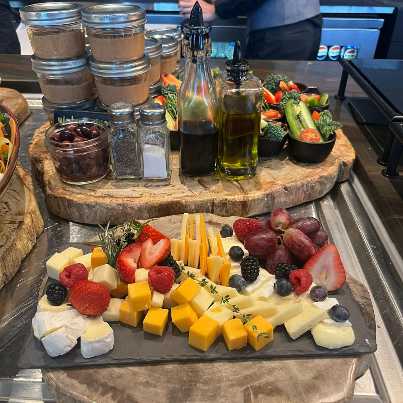 15-jw-marriott-vancouver-lounge-charcuterie-board Evening charcuterie board with fruit, cheese, and veggie dip cups at JW Marriott Lounge.