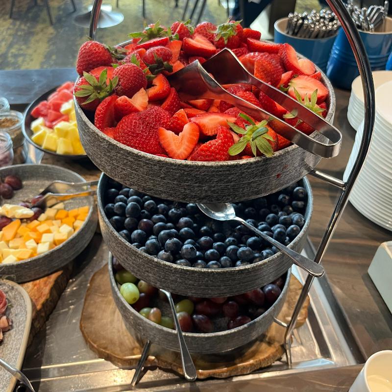 27-jw-marriott-vancouver-lounge-breakfast-fresh-fruit Fresh fruit platter with strawberries, blueberries, grapes, and melon at JW Marriott Vancouver Lounge.