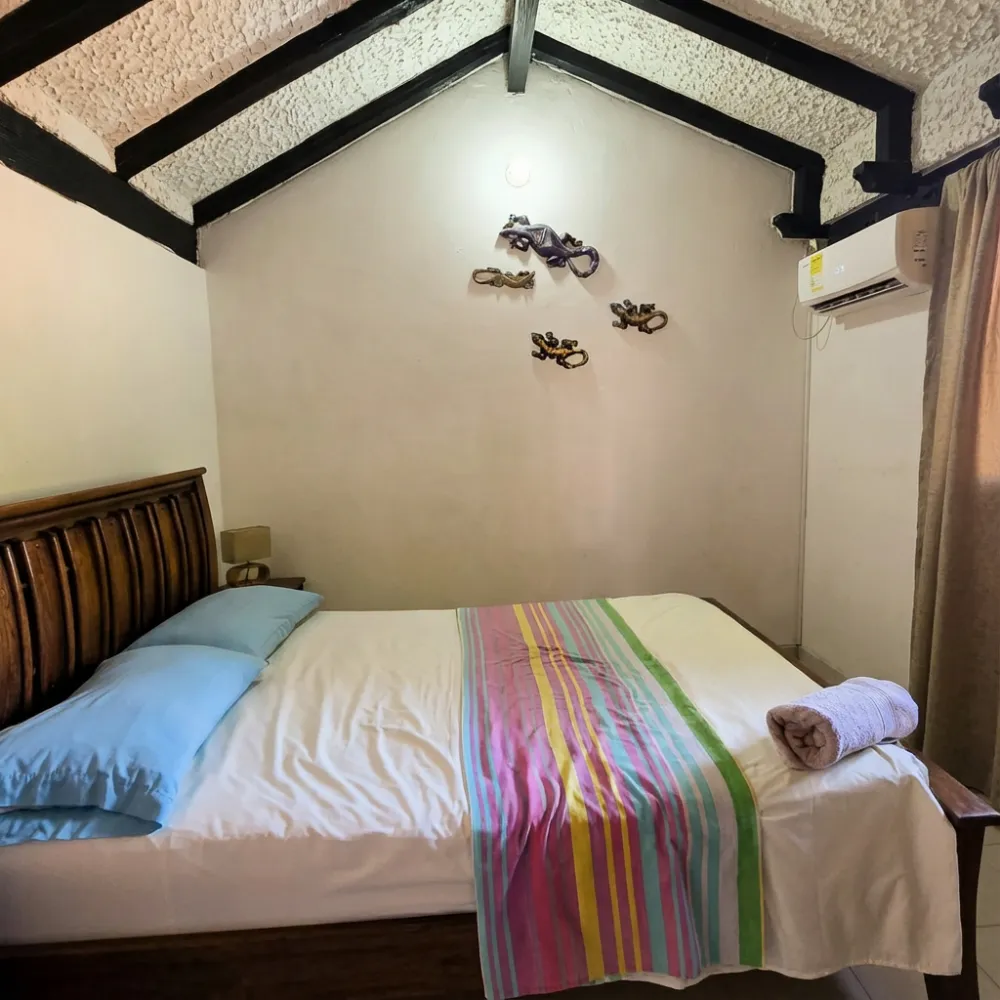 Budget-friendly private room at a Cartagena Airbnb, part of my low-cost Colombia trip without using Amex travel rewards.