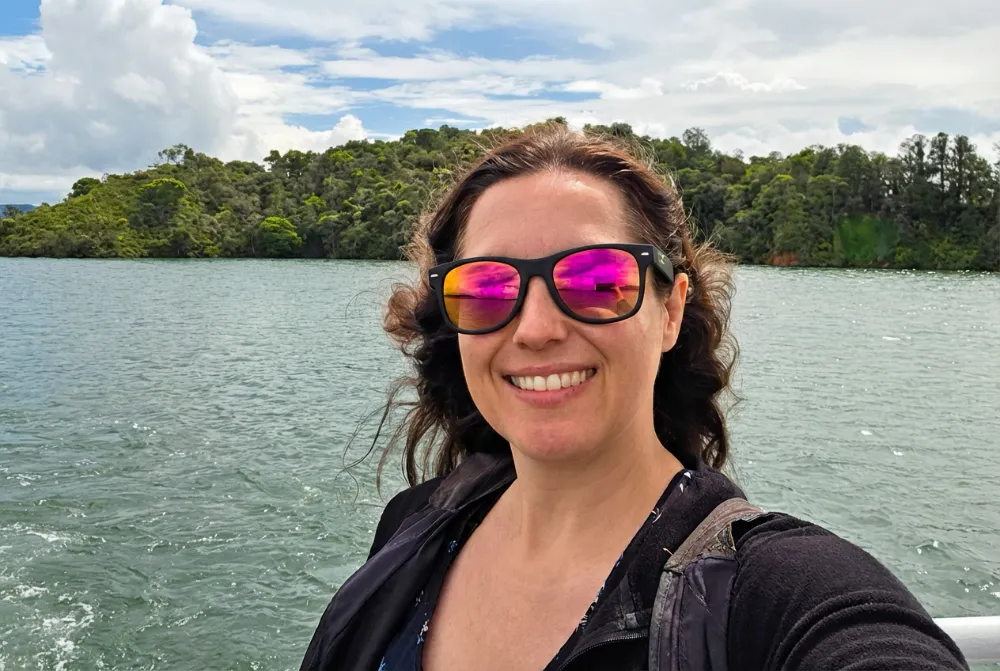 Stephanie on the Guatapé boat tour during a Colombia day trip, showing an experience she paid full price for without earning Amex travel rewards.