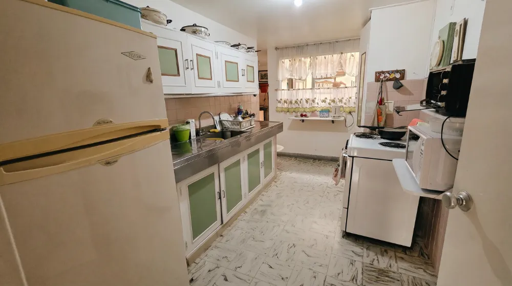 Kitchen in a budget Airbnb in Medellín, Colombia, used during a long-term stay without travel rewards